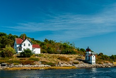 Weathered Squirrel Point Light by the Kennebec River